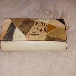 Patchwork Elegance: Coach Billfold Wallet